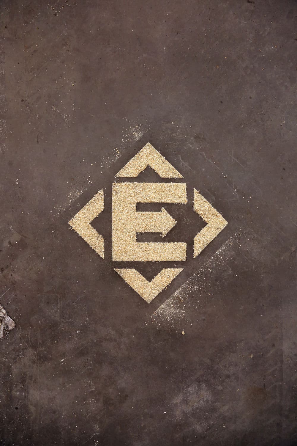 Photography of client logo using sawdust cutout